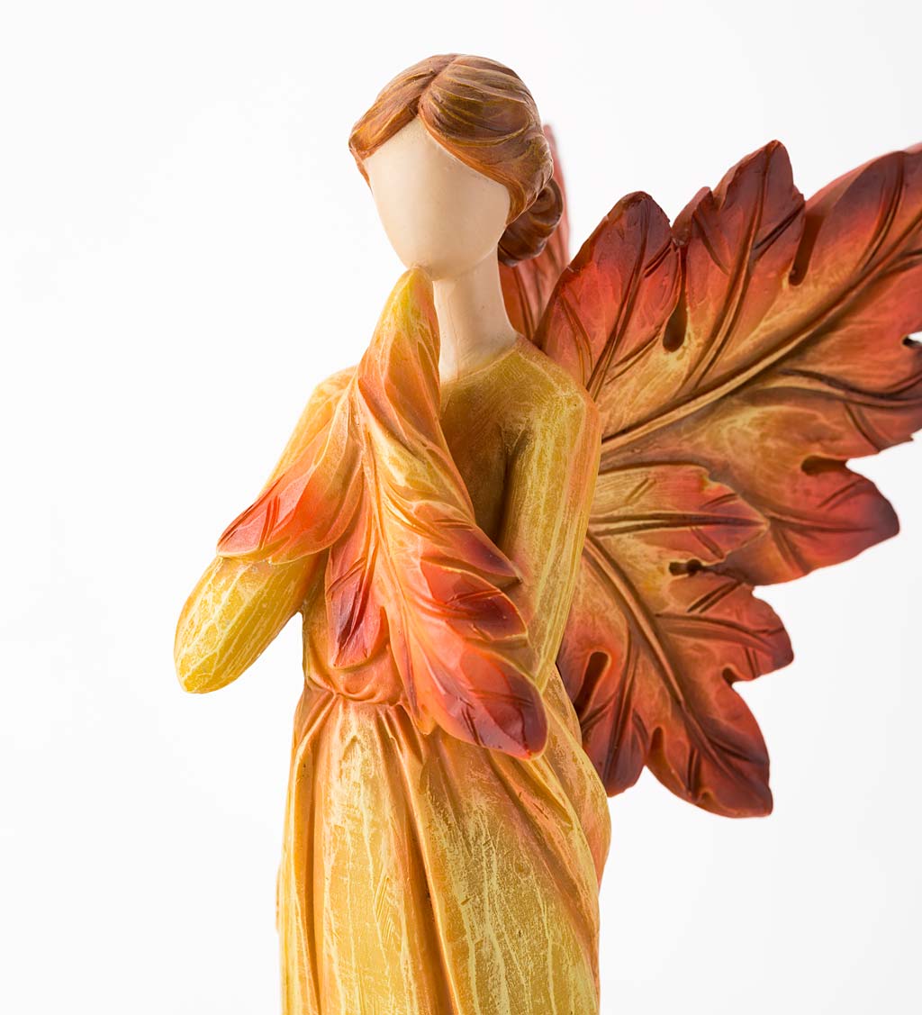 Kneeling Fall Angel with Leaf Wings and Fiery Hues of Autumn